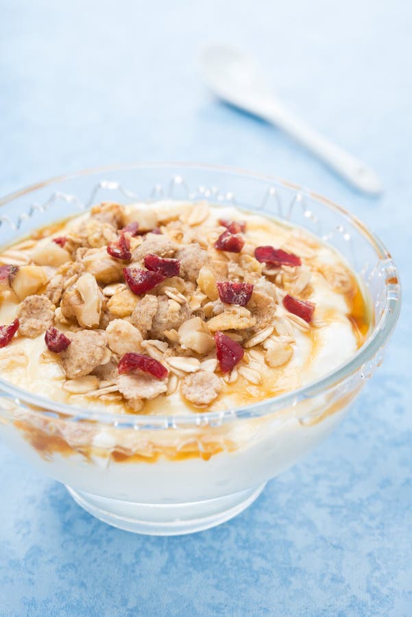 Dessert of Natural Yogurt with Maple Syrup, Granola and Nuts Stock