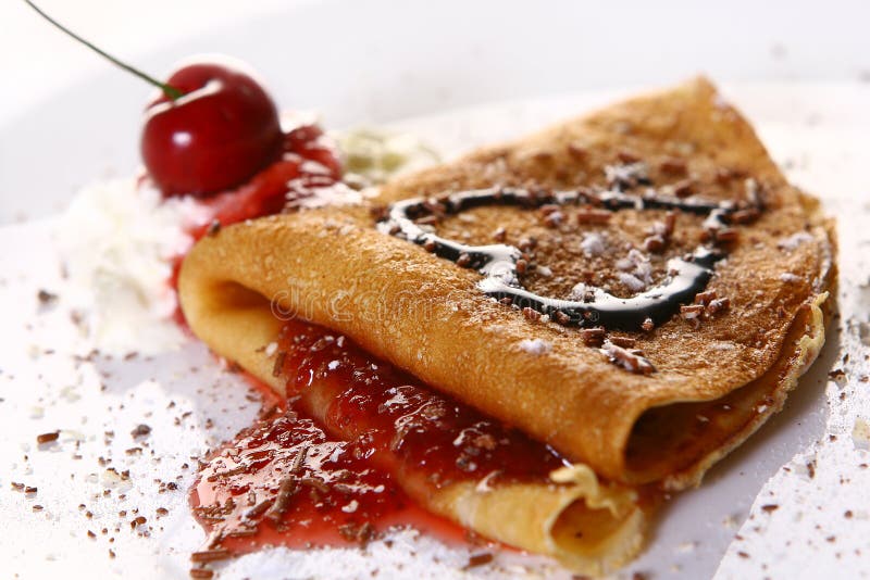 Dessert plate witn pancakes and strawberry