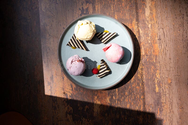 Dessert Platter with Sweet Cake and 3 Scopes of Ice Cream Stock Photo