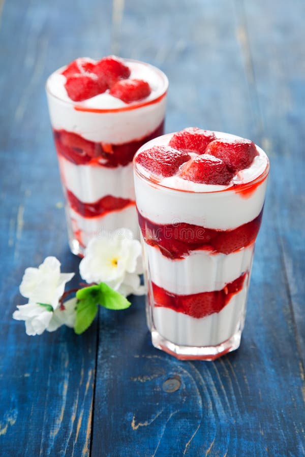 Dessert with strawberry sauce in glass