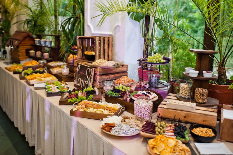 Dessert Table of Delicious Snacks on Wedding Reception Stock Photo