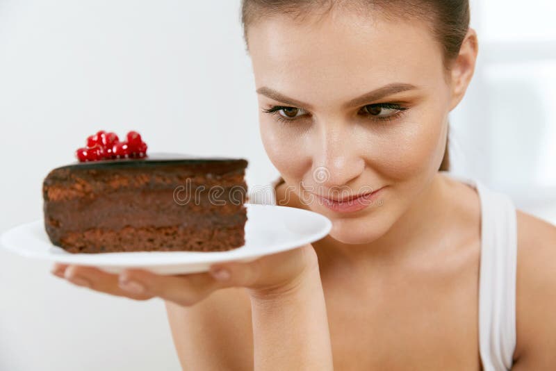 Dessert. Woman Eating Chocolate Cake