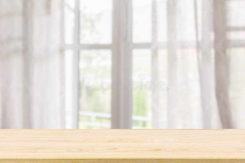 Empty wood table top with window curtain abstract blur background for product display. Empty wood table top with window curtain abstract blur background for product display