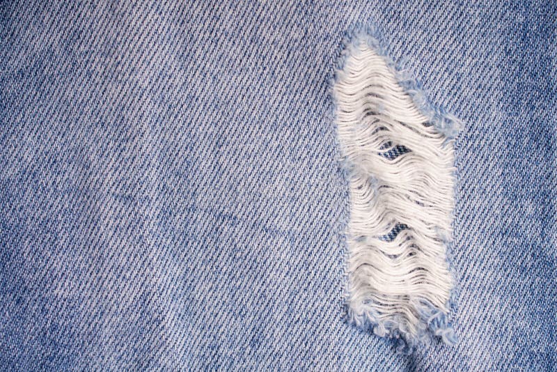 Destroyed Torn Blue Jeans Background. Close Up Blue Ripped Jeans Stock ...