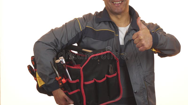 Det kantjusterade skottet av en constructionist med toolboxvisning tummar upp arkivbilder Det kantjusterade skottet av en constructionist med toolboxvisning tummar upp arkivbilder