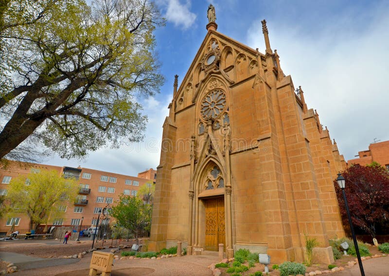 SANTA FE NM USA 04 22 2014: The Loretto Chapel in Santa Fe, New Mexico, USA is a former Roman Catholic church that is now used as a museum and wedding chapel. SANTA FE NM USA 04 22 2014: The Loretto Chapel in Santa Fe, New Mexico, USA is a former Roman Catholic church that is now used as a museum and wedding chapel