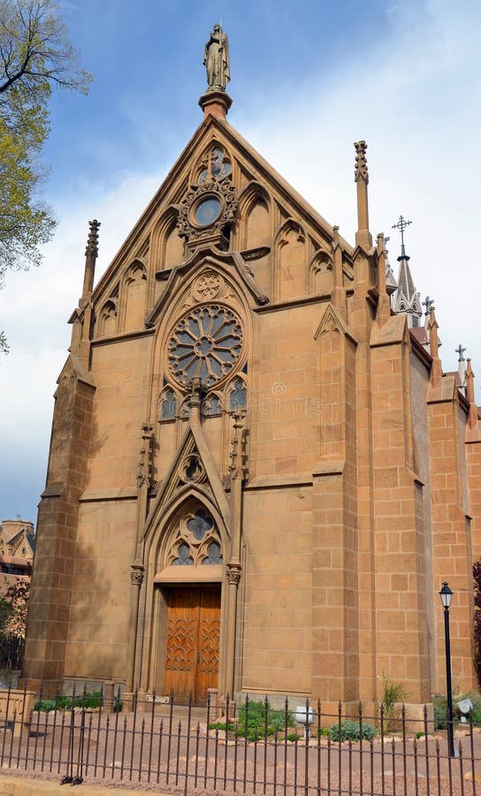 SANTA FE NM USA 04 22 2014: The Loretto Chapel in Santa Fe, New Mexico, USA is a former Roman Catholic church that is now used as a museum and wedding chapel. SANTA FE NM USA 04 22 2014: The Loretto Chapel in Santa Fe, New Mexico, USA is a former Roman Catholic church that is now used as a museum and wedding chapel