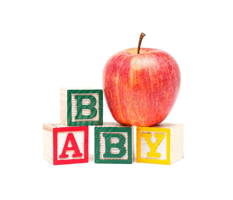 A stack children`s alphabet blocks spelling the word BABY and a fresh apple isolated on white background. A stack children`s alphabet blocks spelling the word BABY and a fresh apple isolated on white background.