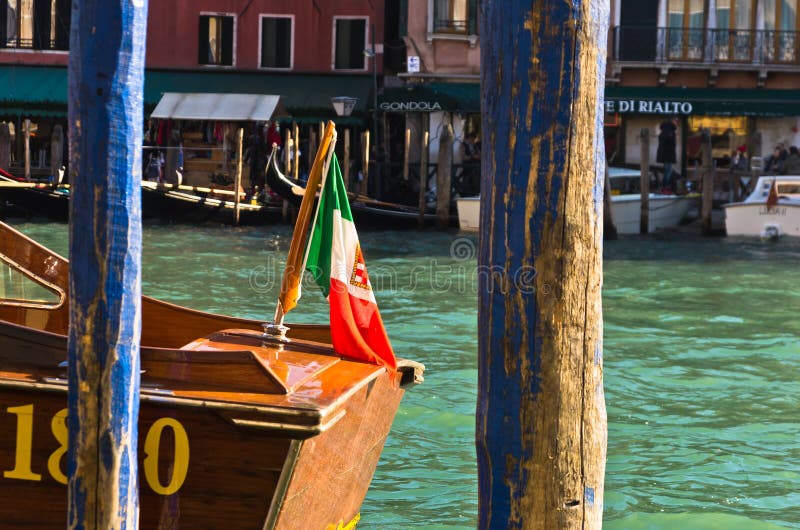 Detail of a boat with Italian flag at Grand canal in Venice