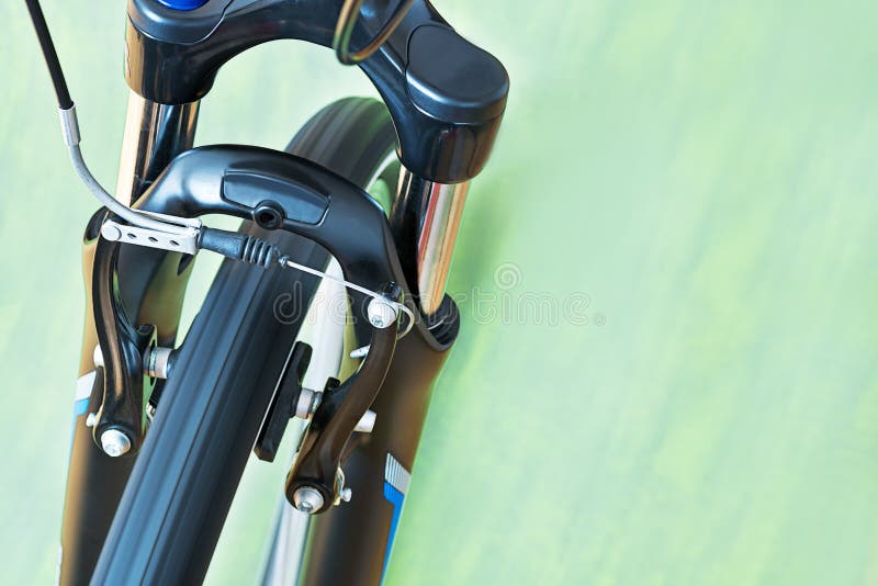 Detail of Caliper Brakes and Suspension Fork of Bicycle Stock Image