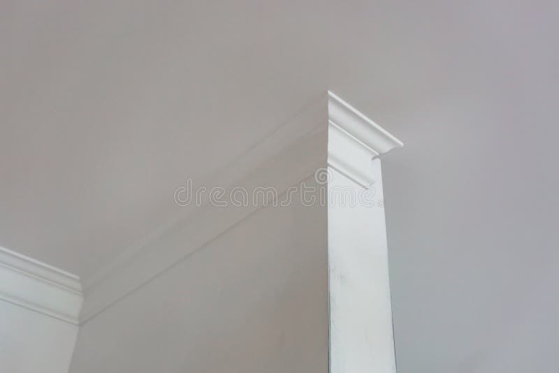 Detail of Corner Ceiling with Intricate Crown Molding Stock Image