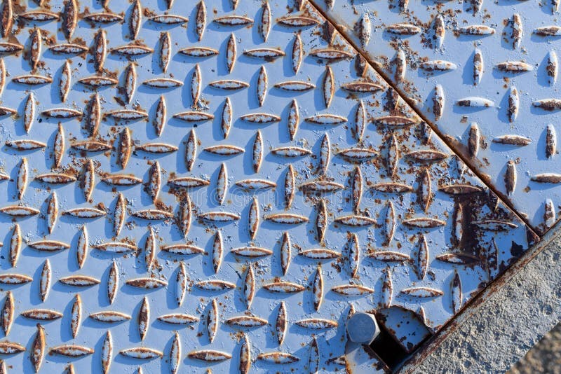 Detail of diamond pattern metal plate royalty free stock image