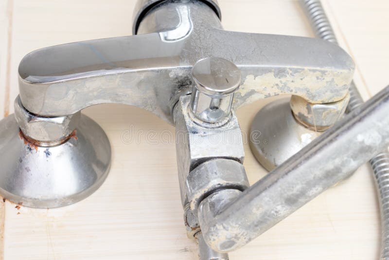 Detail of faucet with limescale or lime scale on it, dirty calcified and rusty shower mixer tap, close up royalty free stock photography