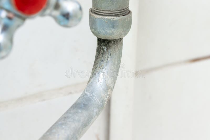 Detail of faucet with limescale or lime scale on it, dirty calcified and rusty shower mixer tap, close up stock photos