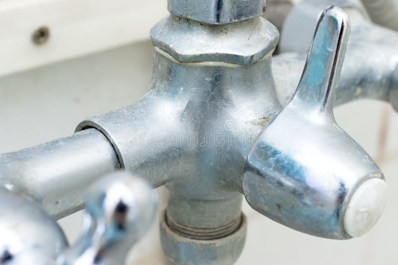 Detail of faucet with limescale or lime scale on it, dirty calcified and rusty shower mixer tap, close up stock image