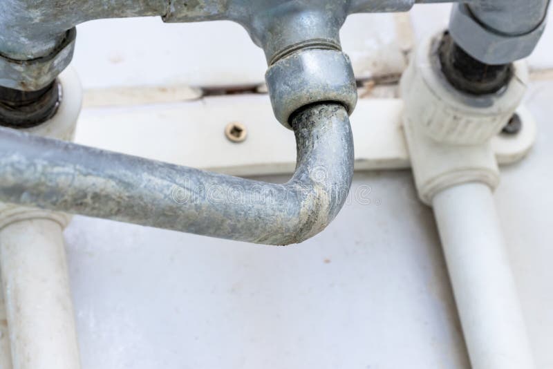 Detail of faucet with limescale or lime scale on it, dirty calcified and rusty shower mixer tap, close up royalty free stock photography