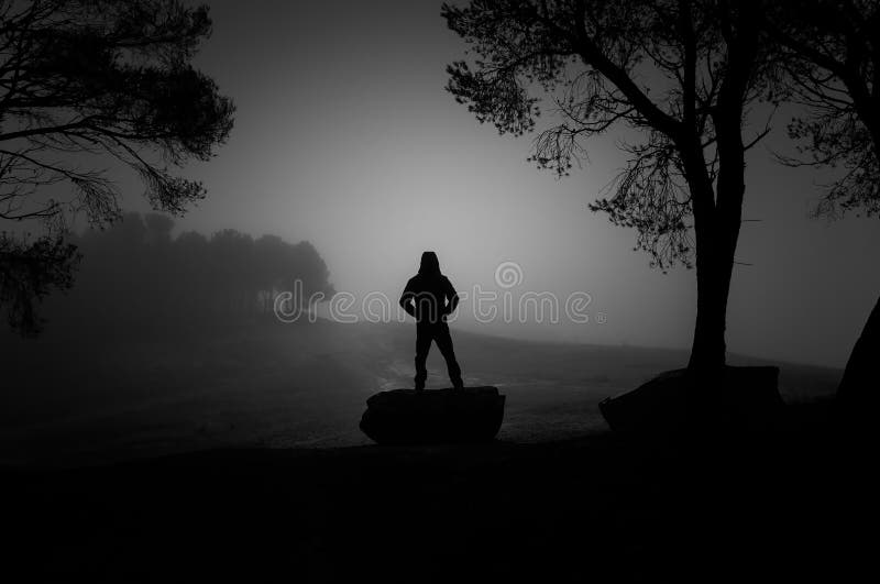 Man in forest in the dark royalty free stock photography