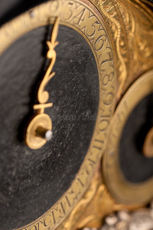 Detail of historic clock, gold and black stock photos