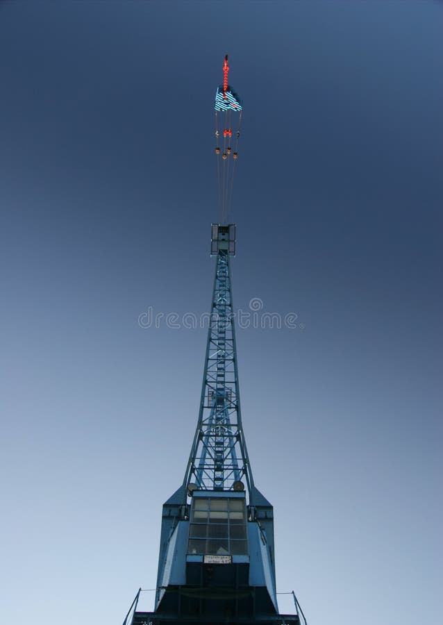 Detail of a huge port crane in blue sky