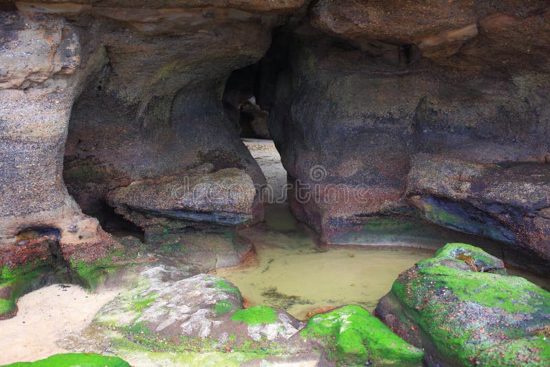 Beach cave cleft at low tide