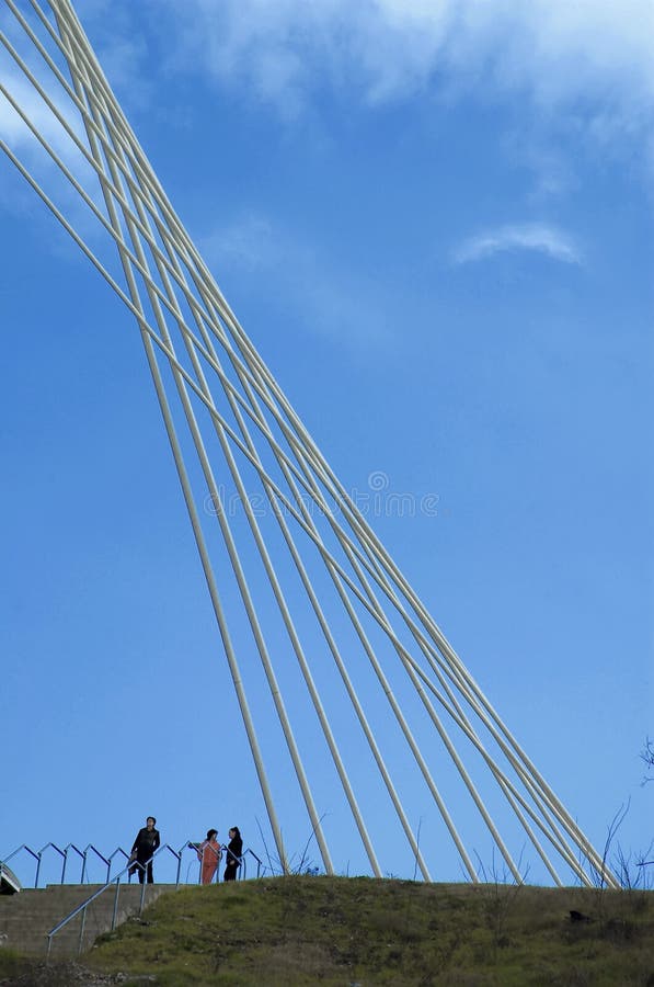 Detail of modern bridge with people at botom