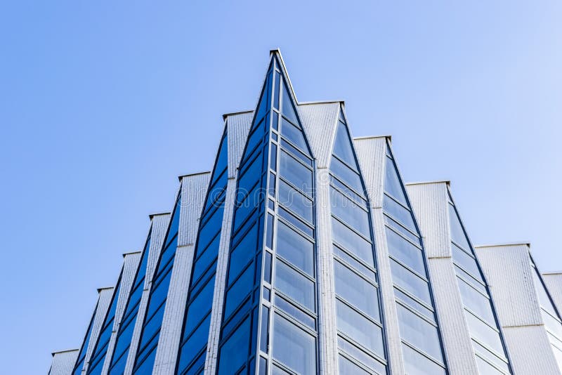 Details of office building exterior. Business buildings skyline looking up with blue sky. Modern architecture apartment. High tech