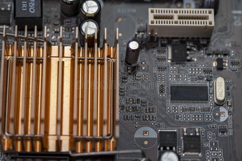 Detail of a Motherboard with Connectors and Heatsinks Stock Photo