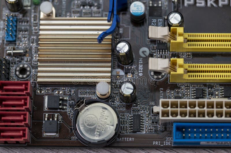 Detail of a Motherboard with Connectors and Heatsinks Stock Photo