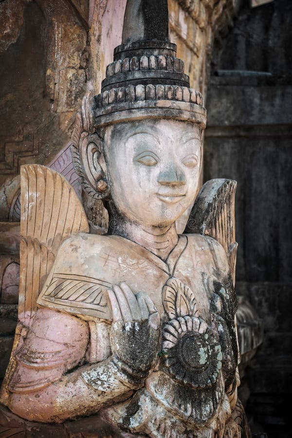 Detail of a nat statue (angel of spirit) in Tharkhaung buddhist monastery in Burma Myanmar royalty free stock photos