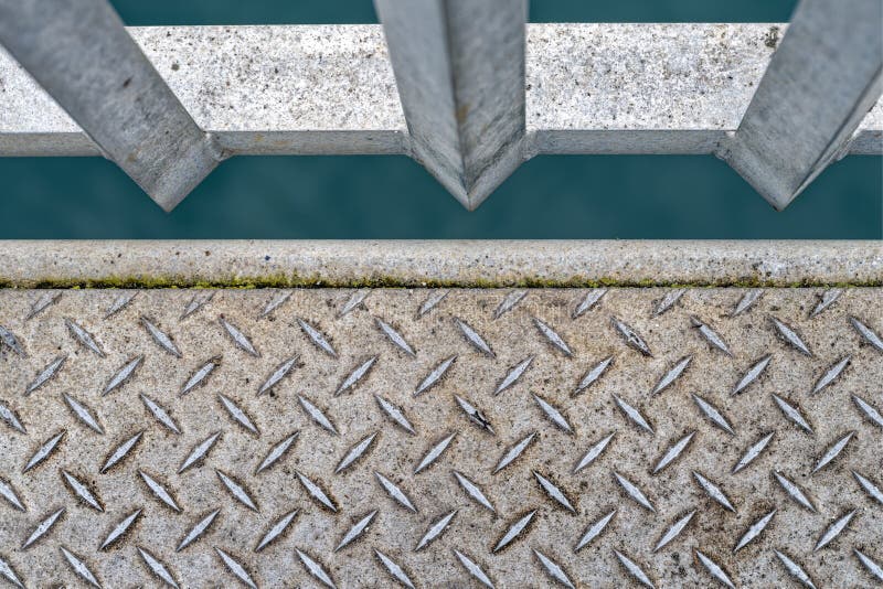 Detail of a non-slip diamond metal surface on a dock stock photos