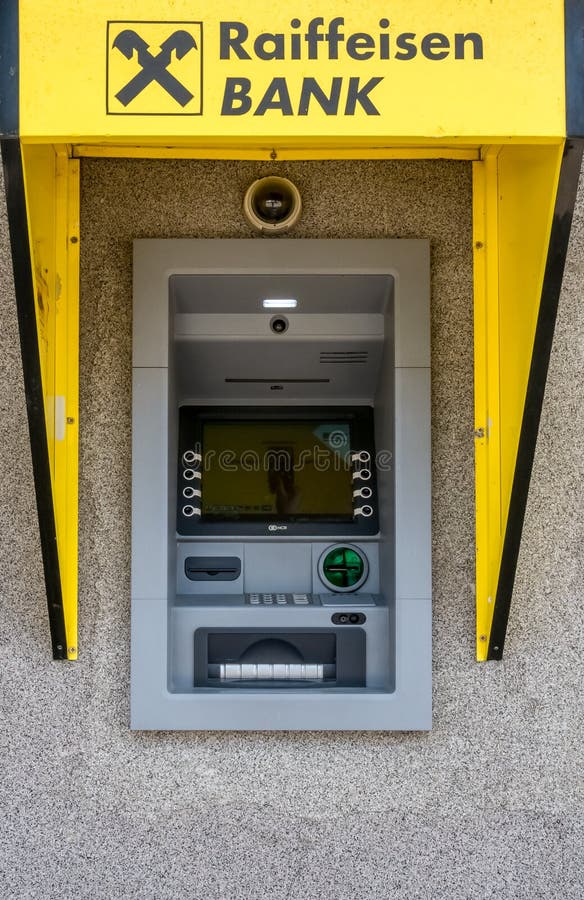 Detail with Raiffeisen bank ATM or cash machine in Bucharest