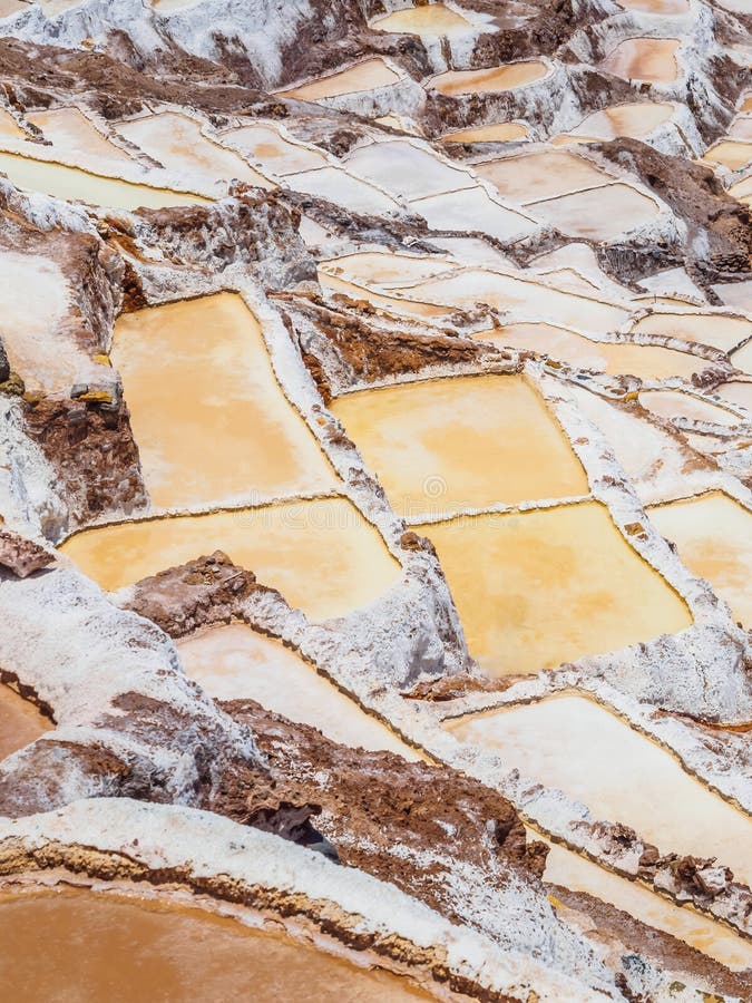 Detail of the salt terraces in the salt pans of Maras, salineras de Maras near Cusco in Peru, salt mines made by man royalty free stock image Detail of the salt terraces in the salt pans of Maras, salineras de Maras near Cusco in Peru, salt mines made by man royalty free stock image