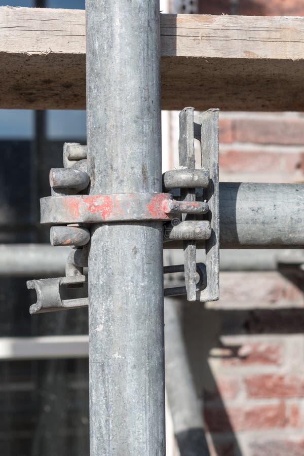 A detail of a scaffold at the front of a newly build villa in the Netherlands