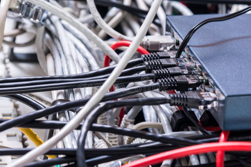 Detail of server room with bunch ethernet cables at the back of royalty free stock photo