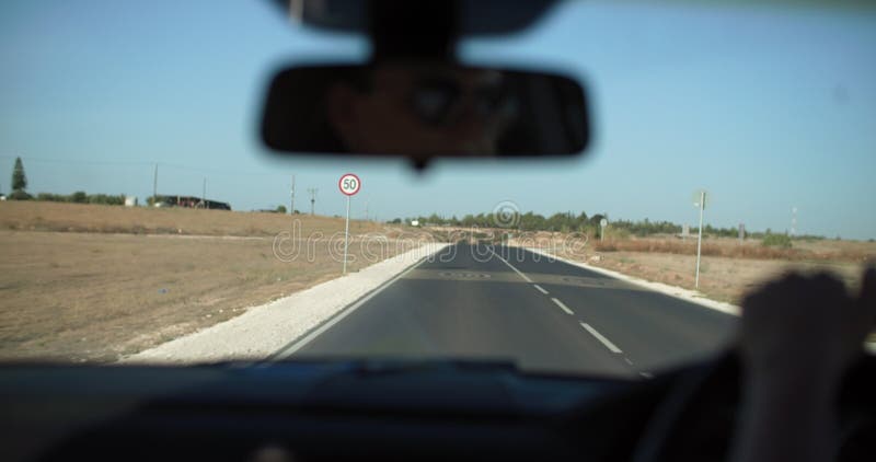 Detail Shot: Female Hand on Steering Wheel, Girl Driving on Road Trip