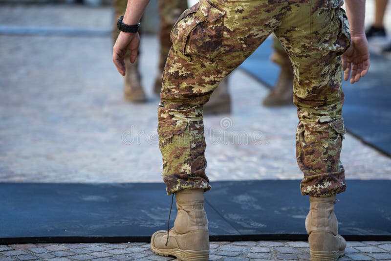 Detail of a Soldier`s Legs: Getting Ready to do Exercises with Camouflage Pants royalty free stock image