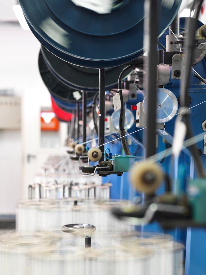 Detail of thread factory production line stock photography