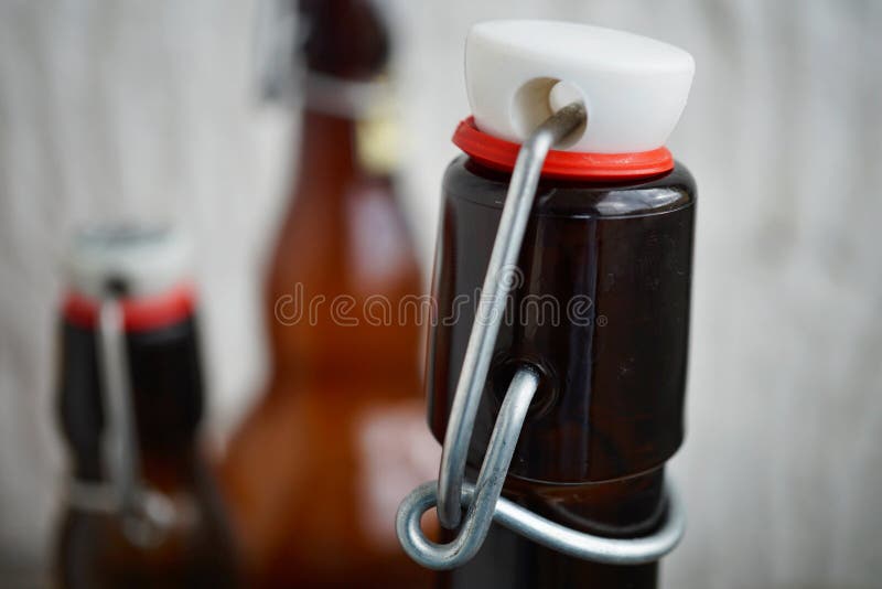 Detail view of beer bottle cap in retro design made of metal, ceramic lid and plastic sealing. As a symbol of expensive beverage container which can be opened royalty free stock photography Detail view of beer bottle cap in retro design made of metal, ceramic lid and plastic sealing. As a symbol of expensive beverage container which can be opened royalty free stock photography
