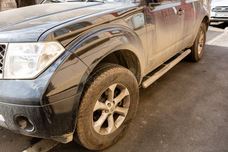 Detail view of dirty Nissan car, dirty wheels. Bucharest, Romania, 2020 royalty free stock images