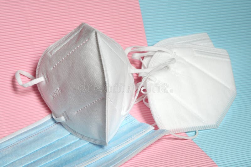 Detail of white KN95 or FFP2 mask with antiviral medical mask for protection against coronavirus on colored background. Prevention of the spread of virus and royalty free stock photos Detail of white KN95 or FFP2 mask with antiviral medical mask for protection against coronavirus on colored background. Prevention of the spread of virus and royalty free stock photos