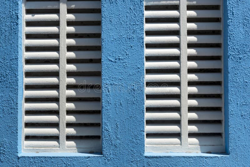 Detail of window with white sun blinds