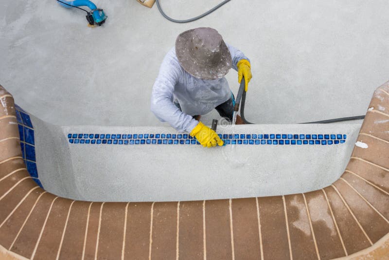 Detail work on new pool plaster amd tile