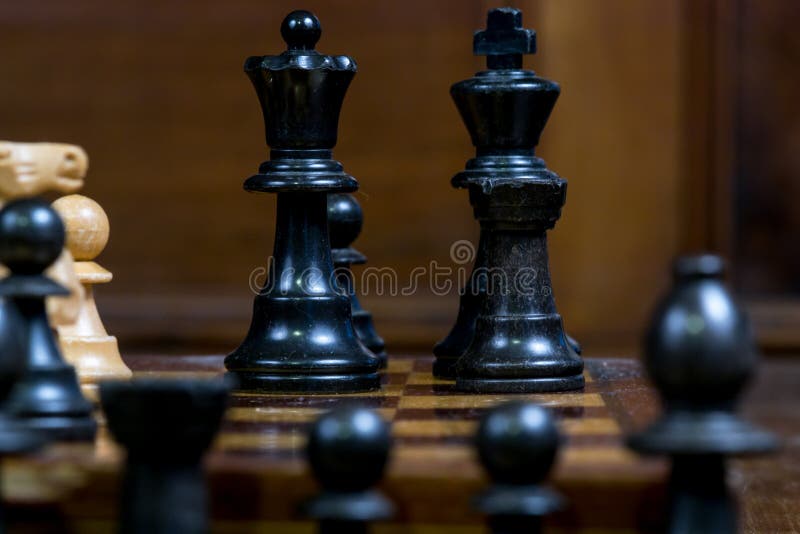 Detailed close up of chess figures - black king, queen, rook, pawn