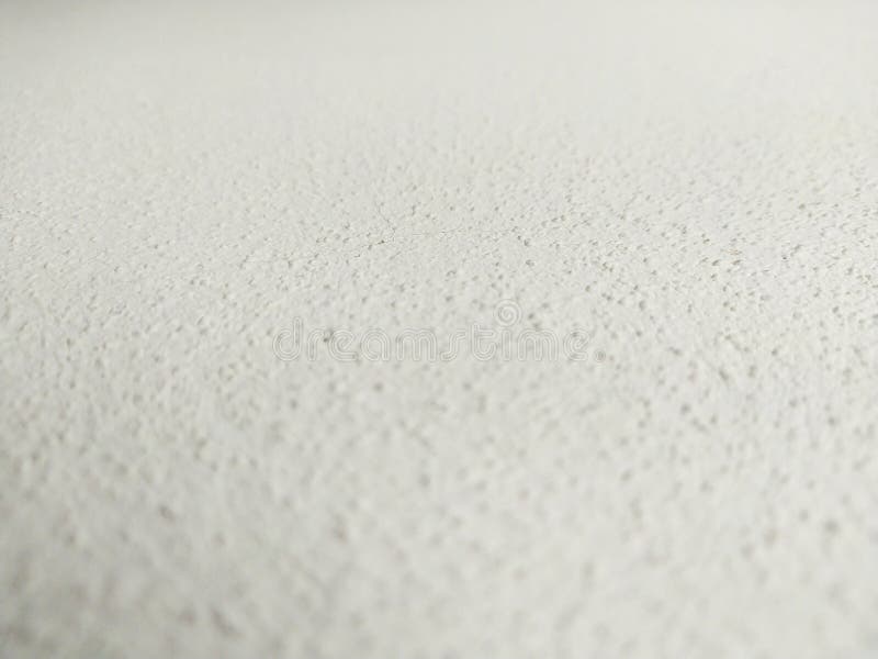 Detailed shot of a textured, light surface, creating depth. Abstract, minimalist backdrop for adding text or graphics. Perfect for stock images