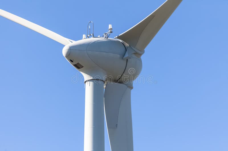 Detailed view of a wind turbine or wind mill, details at the main components: rotor blades, hub, nacelle and generator stock photos