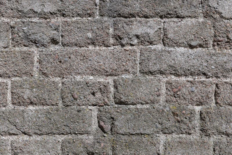 Detaillierte Ansicht einer verwitterten Ziegelwand mit schroffer Struktur lizenzfreie stockfotos