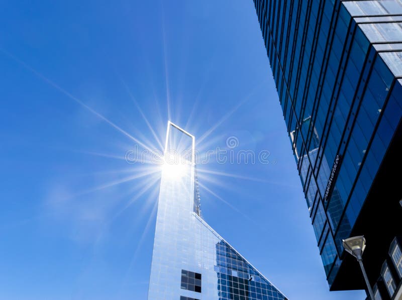 Details of office building exterior. Business buildings skyline looking up with blue sky. Modern architecture apartment. High tech