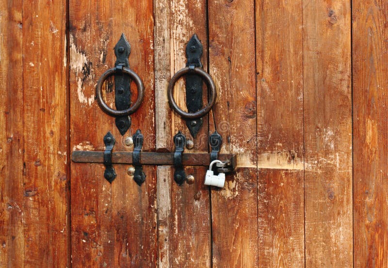 Details of Old Door Lock and Hinge on Wooden Background Stock Photo