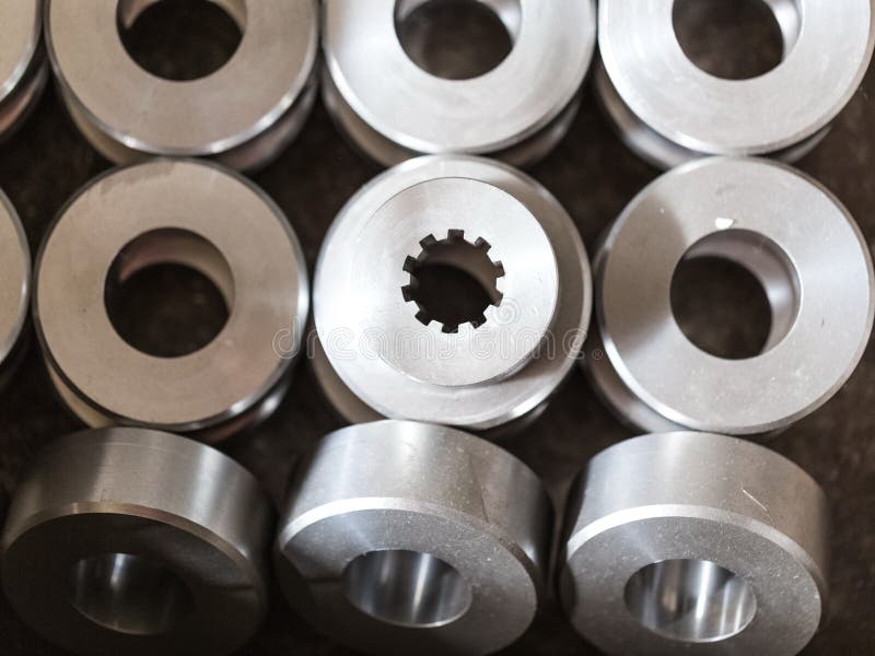 Steel round parts - bushings, rollers, rollers. All the details are the same and only one differs in the form of inner hole. The hole has splines. Steel round parts - bushings, rollers, rollers. All the details are the same and only one differs in the form of inner hole. The hole has splines.