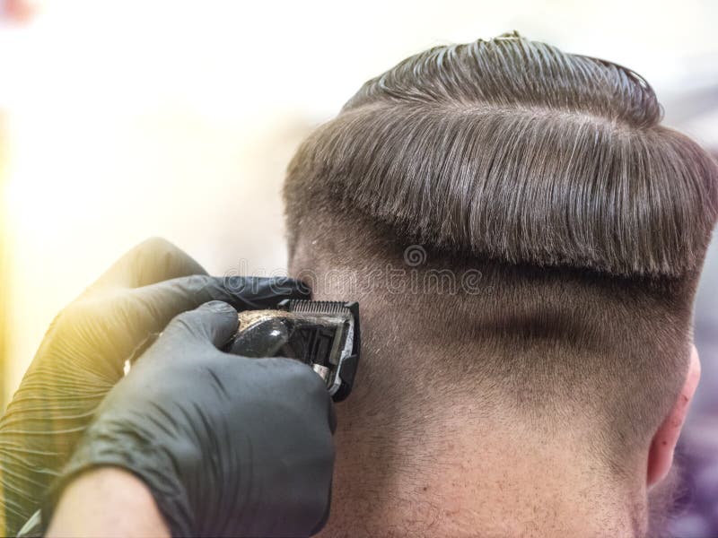Details of trimming. Cropped closeup of a barber trimming hair royalty free stock photos Details of trimming. Cropped closeup of a barber trimming hair royalty free stock photos